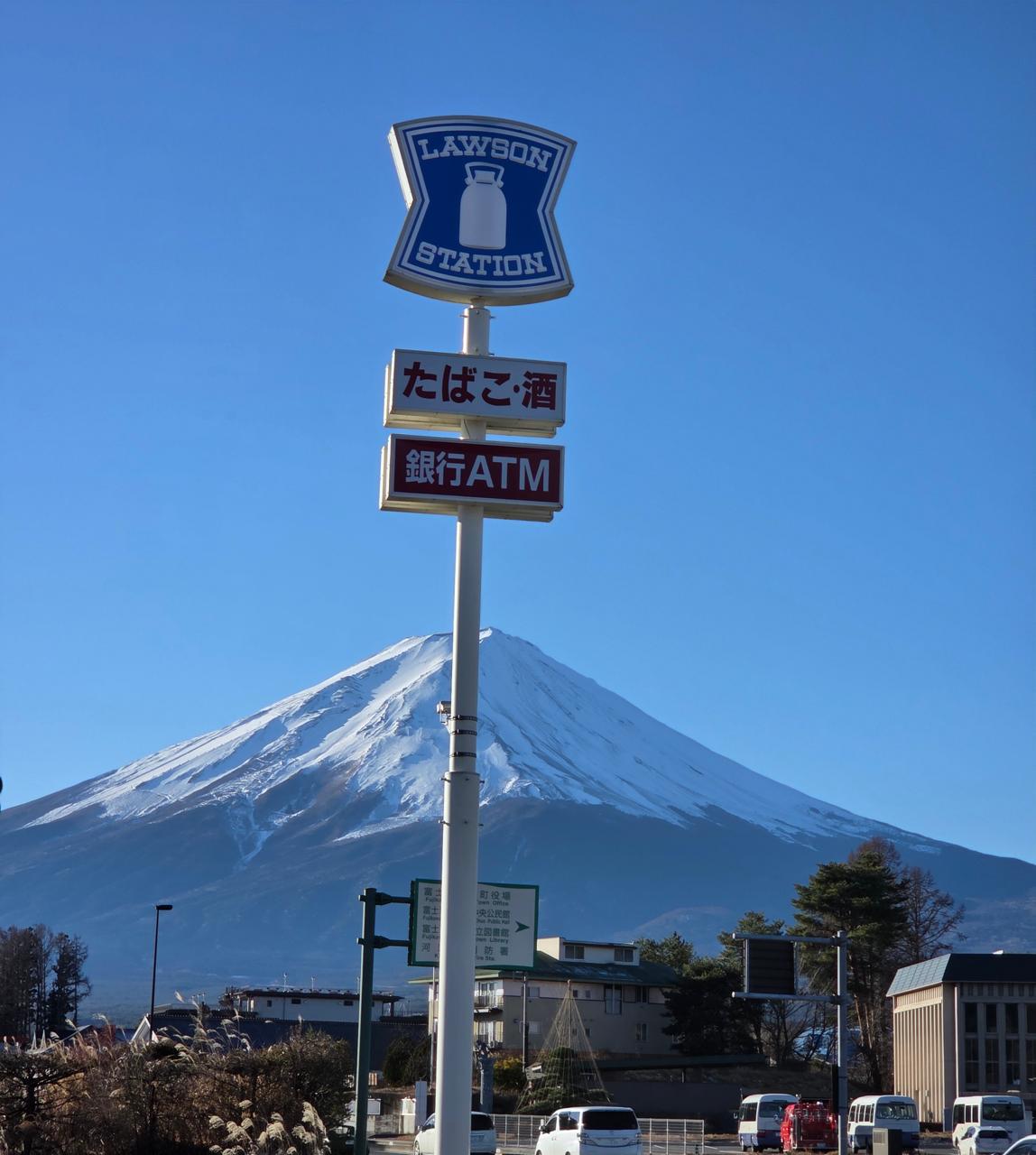 Lawson Station sign with snow-capped Mount Fuji behind